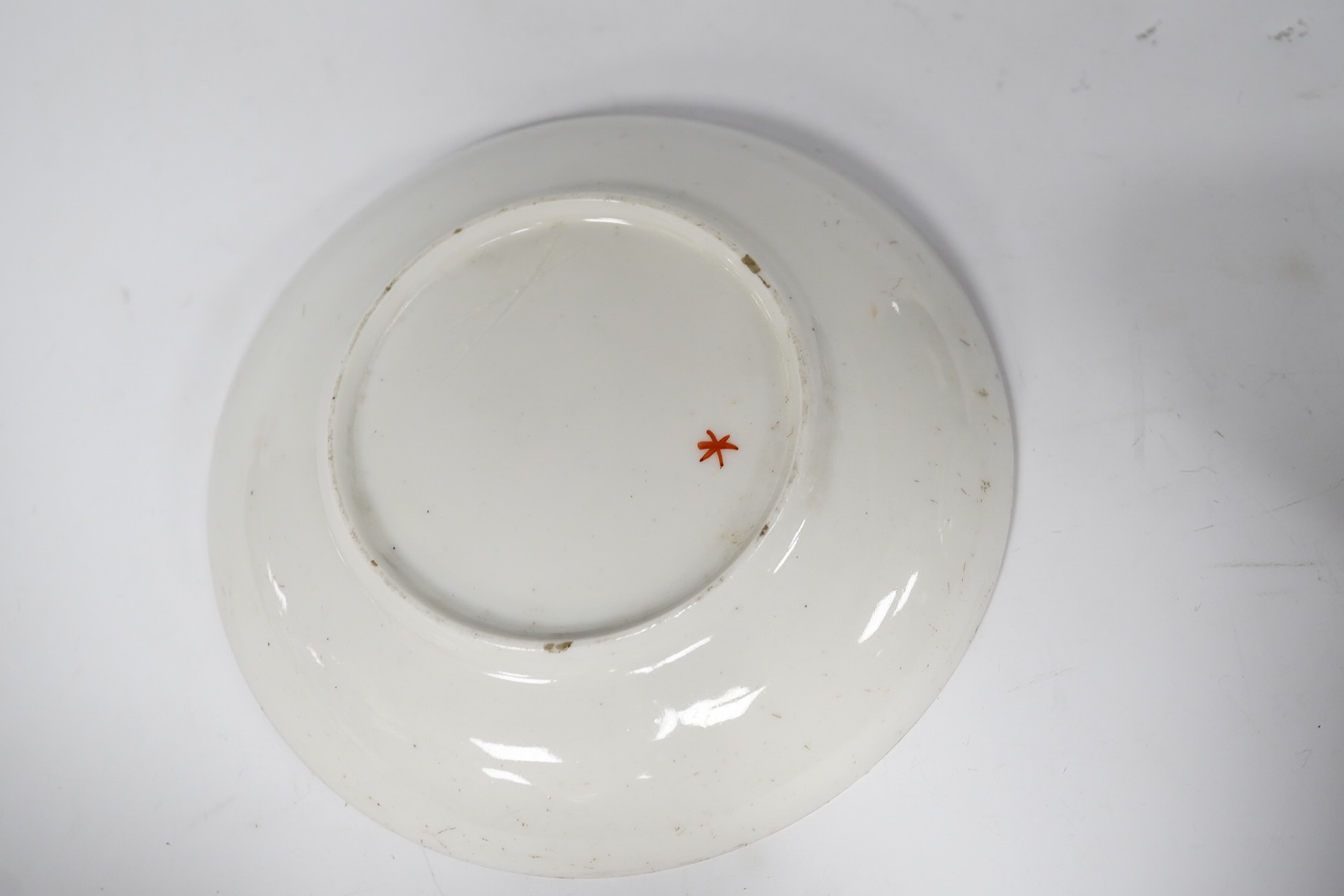 A Nove porcelain tea bowl and saucer, c.1770-75, hand painted with Chinese figures, iron red asterisk marks, 11.5cm in diameter